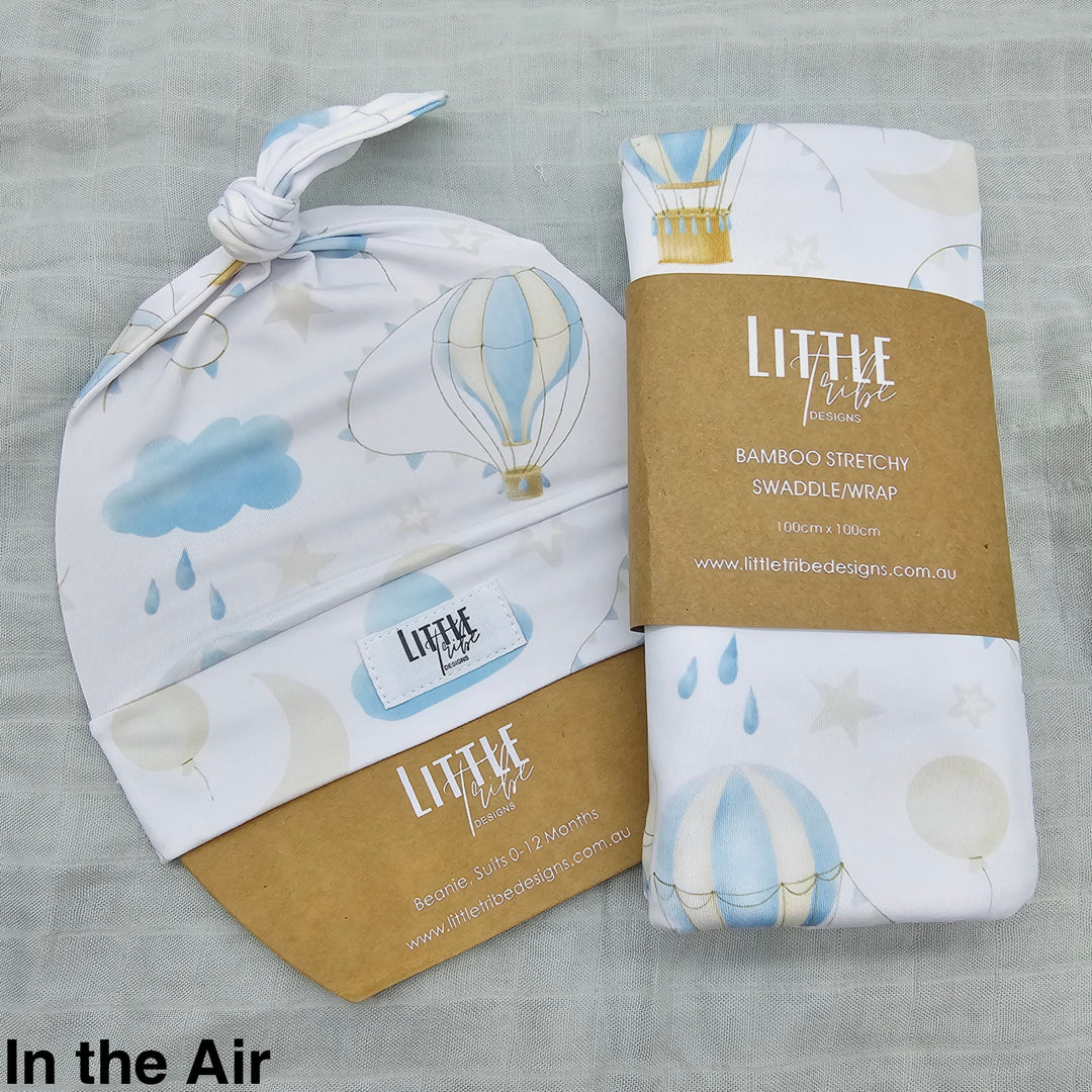 Bamboo Baby Swaddle And Beanie Set In The Air