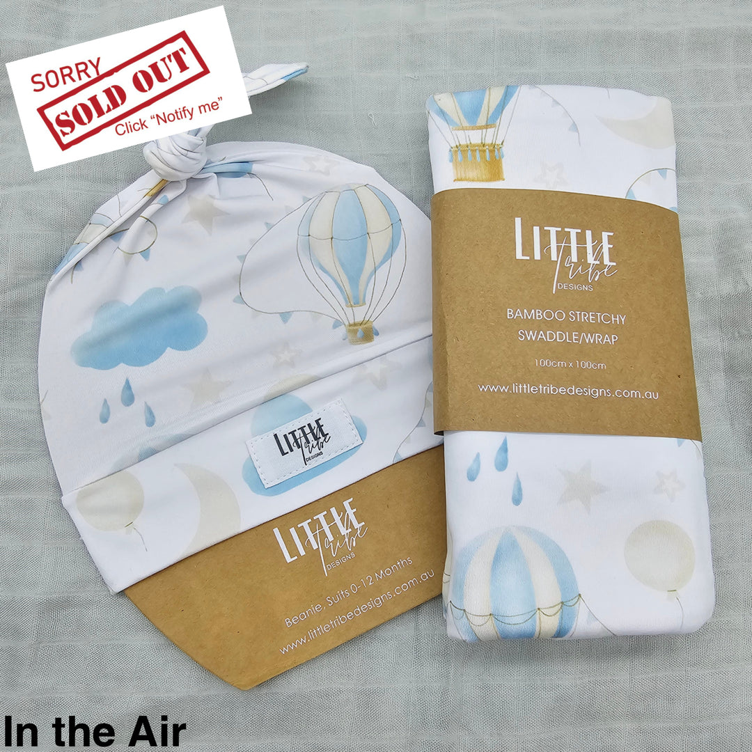 Bamboo Baby Swaddle And Beanie Set In The Air